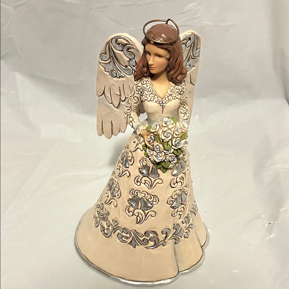 Jim Shore 25th anniversary figurine.